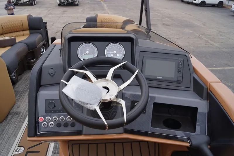 Slide: The Image of Steering console of 2026 Avalon Catalina Versatile Rear Bench boat, featuring modern controls and gauges. - 14