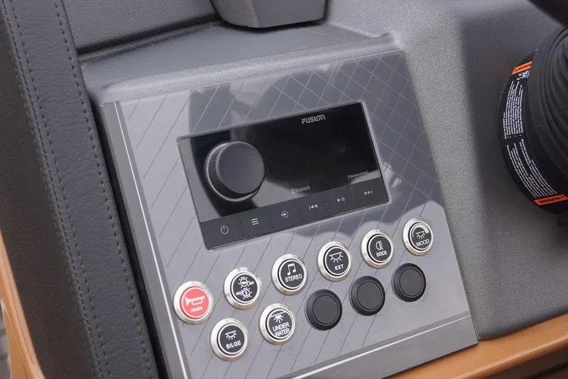 Slide: The Image of Control panel of 2026 Avalon Catalina Versatile Rear Bench boat with various function buttons. - 21