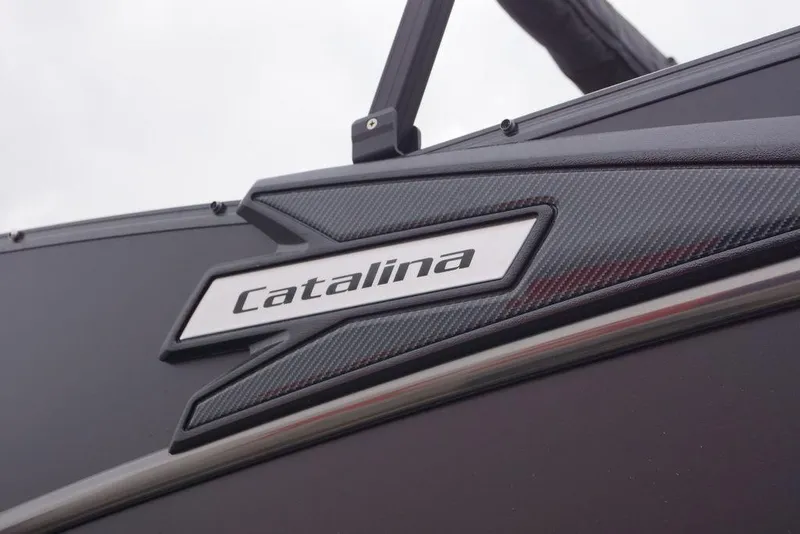 Slide: The Image of 2026 Avalon Catalina Versatile Rear Bench boat logo on sleek black surface. - 7