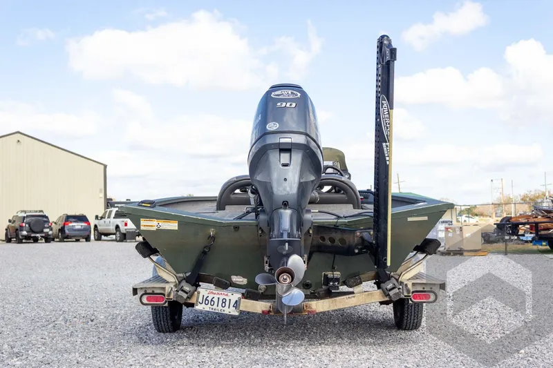 Slide: The Image of 2015 Xpress H17 boat on trailer with outboard motor, parked in gravel lot. - 10