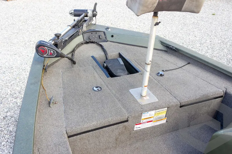 Slide: The Image of 2015 Xpress H17 boat interior with trolling motor and seating. - 13