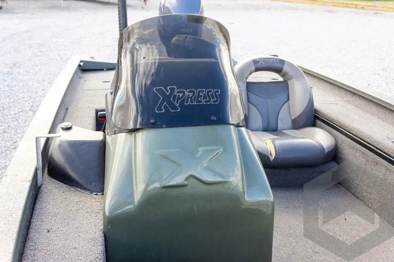 Slide: The Image of 2015 Xpress H17 boat interior with console and seating. - 17