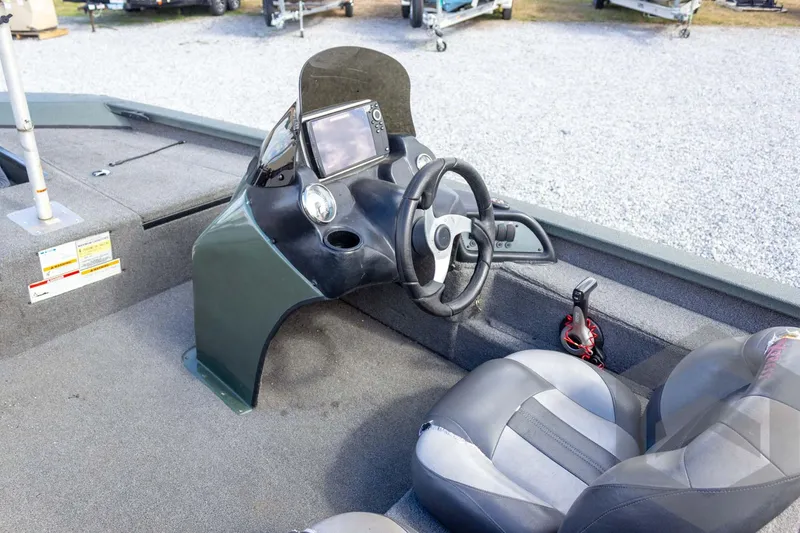 Slide: The Image of 2015 Xpress H17 boat interior with steering wheel and navigation system. - 19