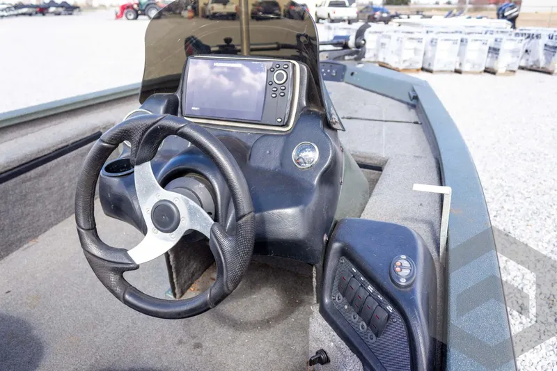 Slide: The Image of 2015 Xpress H17 boat dashboard with steering wheel and navigation system. - 20