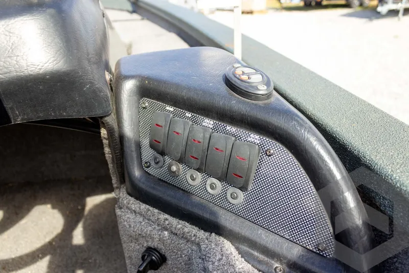 Slide: The Image of Control panel of 2015 Xpress H17 boat with switches and buttons. - 21