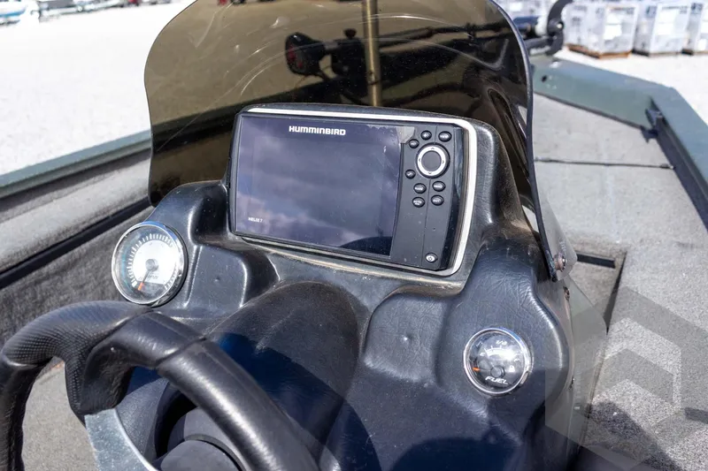 Slide: The Image of 2015 Xpress H17 boat dashboard with Humminbird Helix 7 fishfinder and gauges. - 22