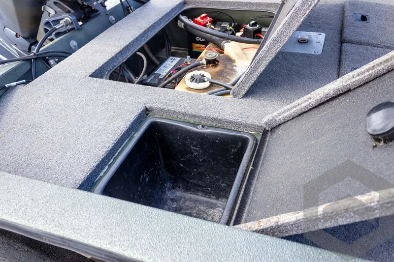 Slide: The Image of 2015 Xpress H17 boat interior showing storage compartments and battery setup. - 26