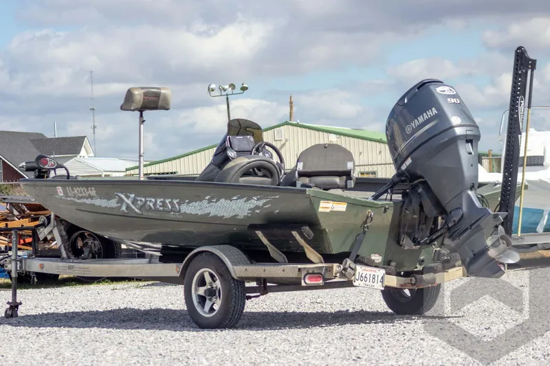Slide: The Image of 2015 Xpress H17 boat with Yamaha motor on trailer, parked outdoors. - 3