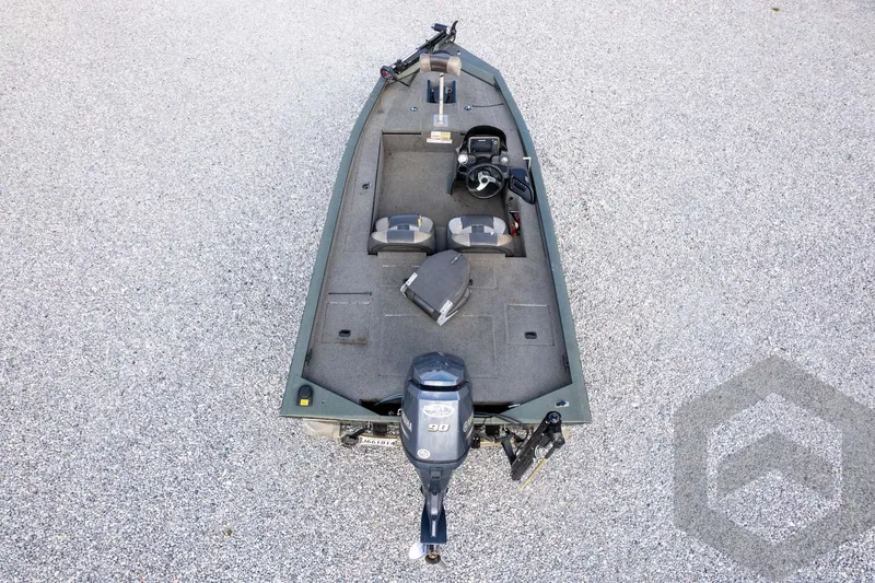 Slide: The Image of 2015 Xpress H17 boat with motor, viewed from above on gravel surface. - 30