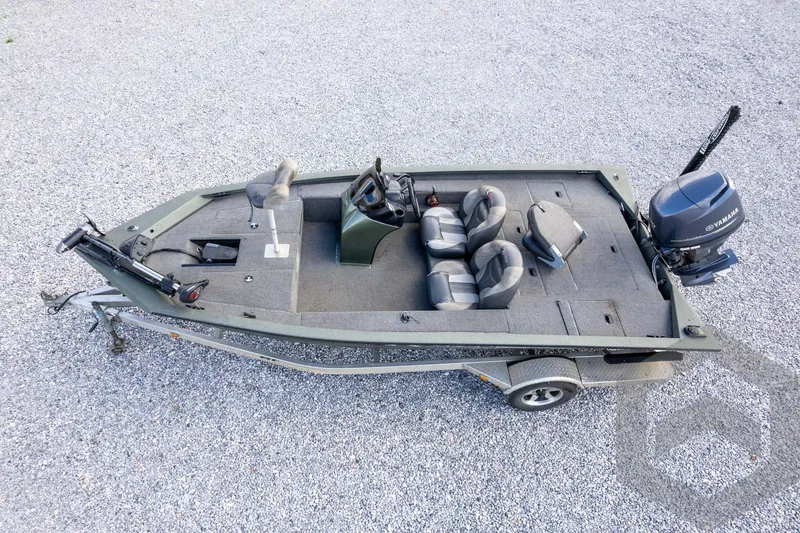 Slide: The Image of 2015 Xpress H17 fishing boat with Yamaha motor on gravel surface. - 32