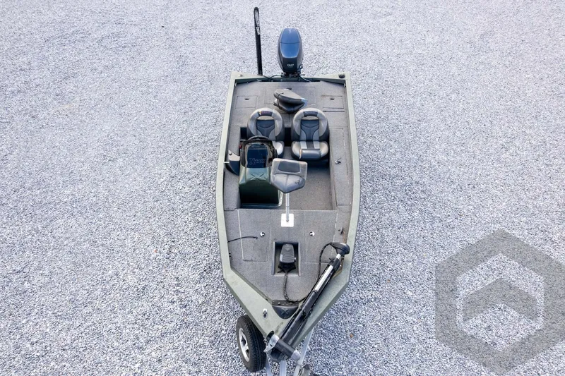 Slide: The Image of 2015 Xpress H17 fishing boat on gravel, featuring seating and motor. - 34