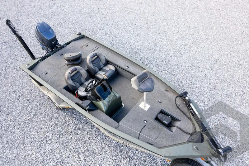 Slide: The Image of 2015 Xpress H17 fishing boat with dual seats and outboard motor on gravel surface. - 35