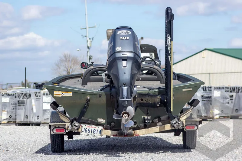 Slide: The Image of 2015 Xpress H17 boat with Yamaha 90 engine on trailer, outdoor setting. - 4