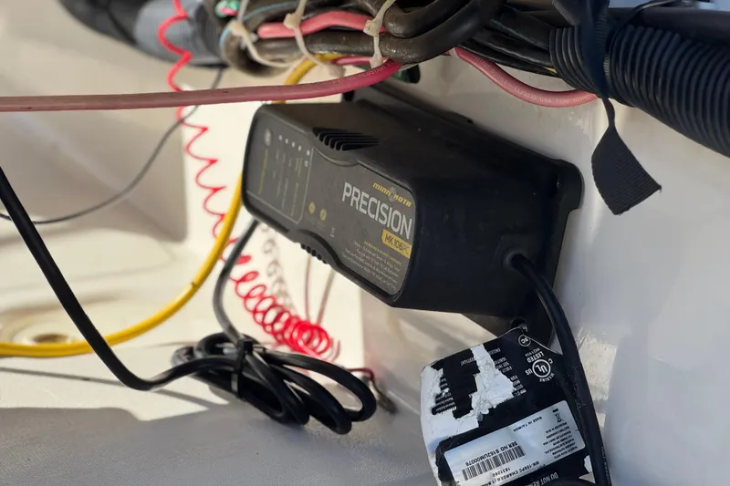 Slide: The Image of Battery charger setup on a 2000 Boston Whaler 13 Sport boat. - 15