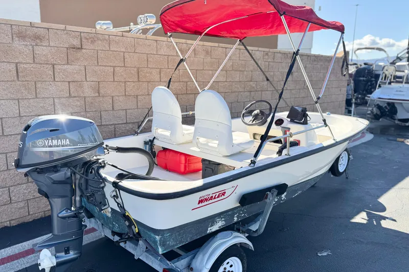 Slide: The Image of 2000 Boston Whaler 13 Sport boat with Yamaha outboard motor and red canopy. - 5