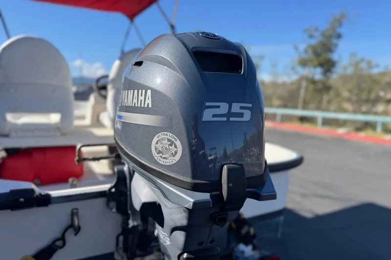 Slide: The Image of Yamaha 25 outboard motor on a 2000 Boston Whaler 13 Sport boat. - 7