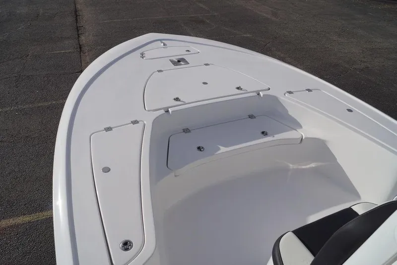 Slide: The Image of 2026 Tidewater 2410 Bay Max boat deck with storage compartments and seating. - 10