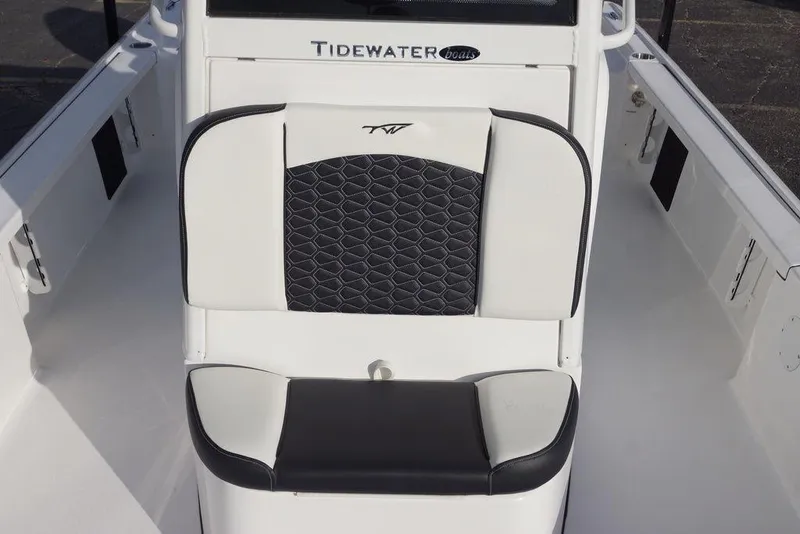 Slide: The Image of 2026 Tidewater 2410 Bay Max boat interior with cushioned seating and sleek design. - 11