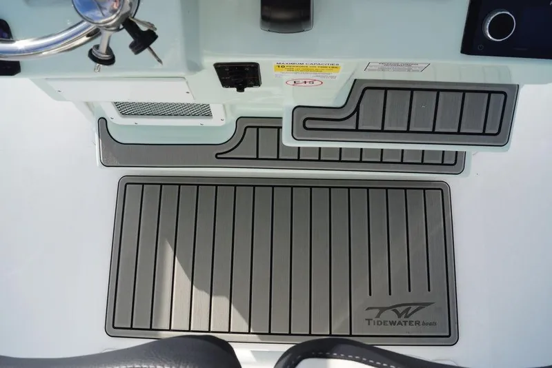 Slide: The Image of 2026 Tidewater 2410 Bay Max boat deck with branded non-slip mats. - 16