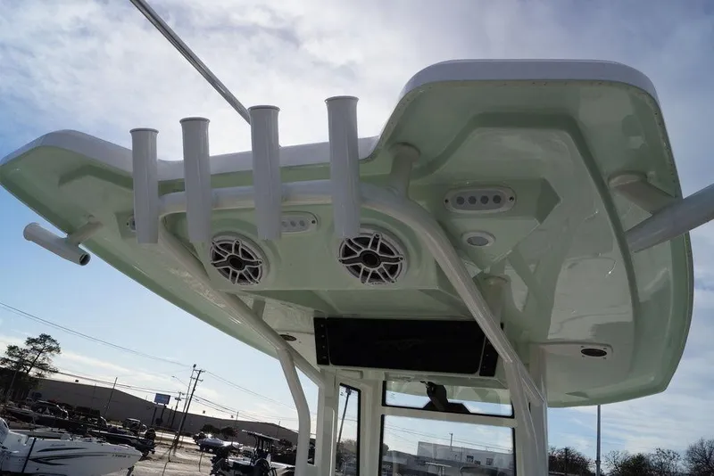 Slide: The Image of 2026 Tidewater 2410 Bay Max boat with rod holders and speakers on the T-top. - 19