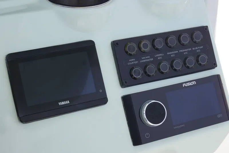 Slide: The Image of Control panel of 2026 Tidewater 2410 Bay Max boat with Yamaha and Fusion displays. - 21