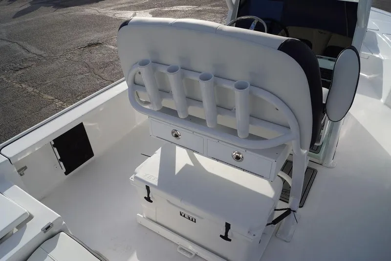 Slide: The Image of 2026 Tidewater 2410 Bay Max boat interior with rod holders and Yeti cooler. - 24
