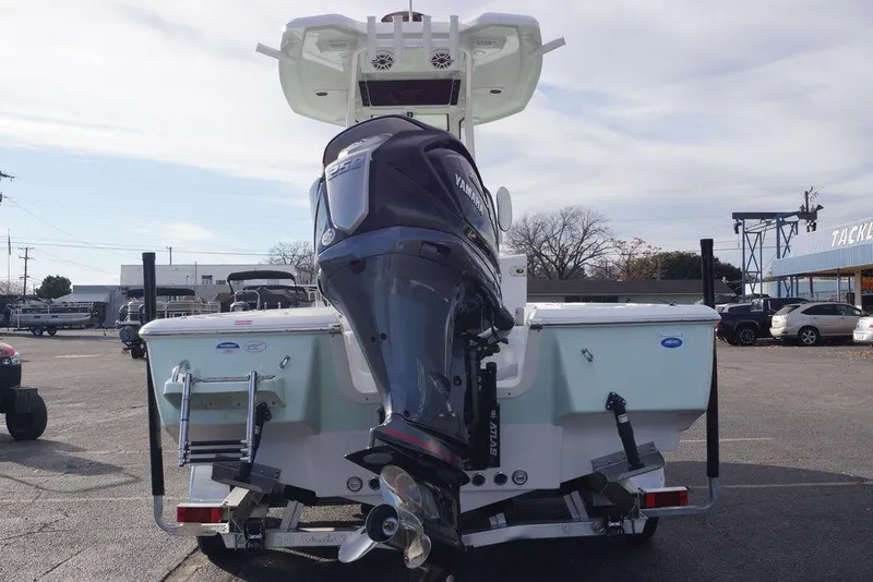 Slide: The Image of 2026 Tidewater 2410 Bay Max boat with Yamaha engine, parked outdoors. - 6