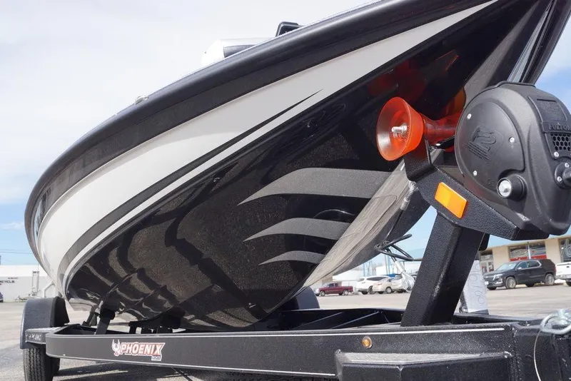 Slide: The Image of 2026 Phoenix 721 ZXL boat on trailer, showcasing sleek black and white design. - 10