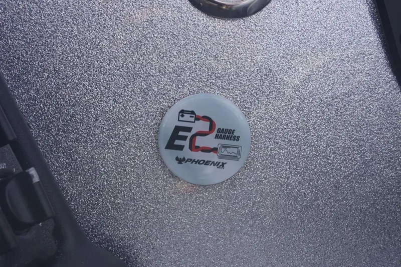 Slide: The Image of Sticker on a 2026 Phoenix 721 ZXL boat, featuring "EC2 Gauge Harness" logo. - 11