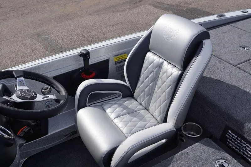 Slide: The Image of 2026 Phoenix 721 ZXL boat interior with luxury seating and steering wheel. - 16