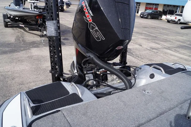 Slide: The Image of 2026 Phoenix 721 ZXL boat with Mercury Pro XS engine in parking lot. - 5