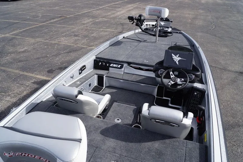 Slide: The Image of 2026 Phoenix 721 ZXL boat interior with steering wheel and seating, showcasing modern design. - 7
