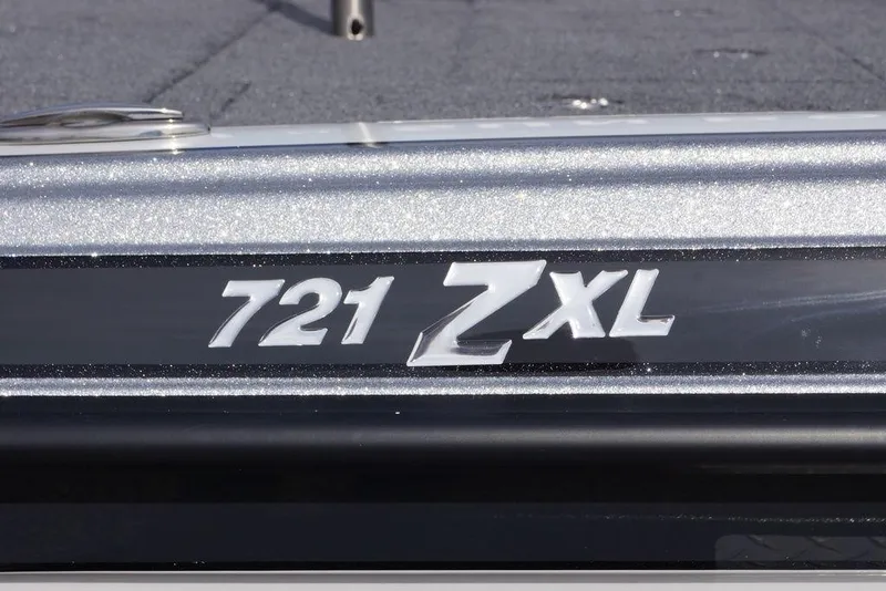 Slide: The Image of Phoenix 721 ZXL 2026 model emblem on metallic surface. - 8