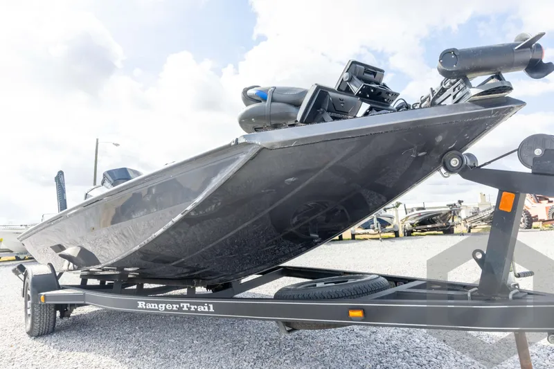 Slide: The Image of 2020 Ranger RT188P boat on trailer, displayed outdoors under cloudy sky. - 10