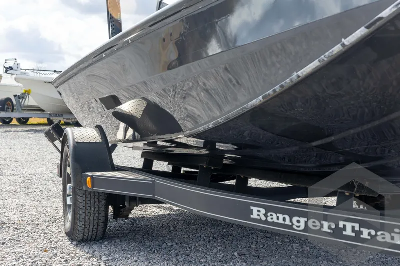 Slide: The Image of 2020 Ranger RT188P boat on trailer, parked on gravel lot. - 11