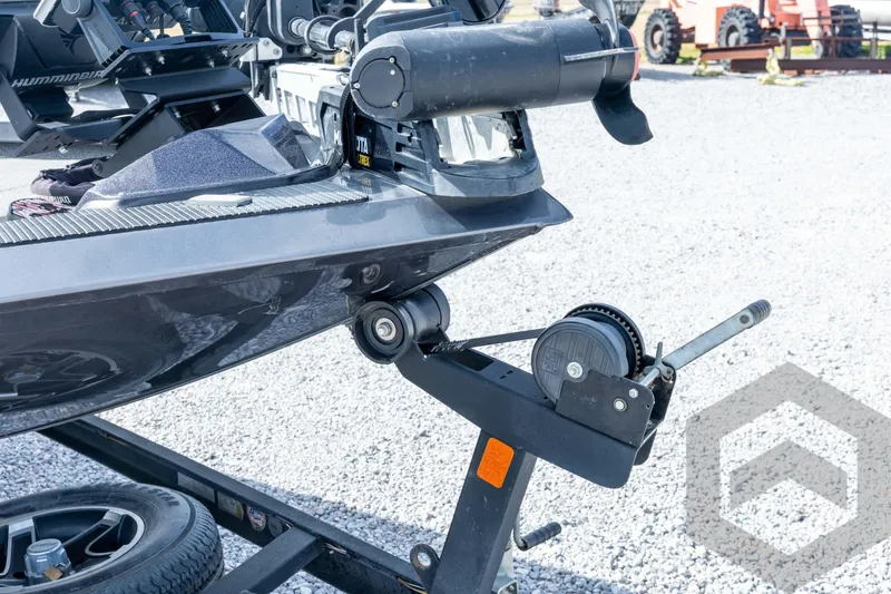 Slide: The Image of 2020 Ranger RT188P boat on trailer with winch and motor, parked on gravel. - 13