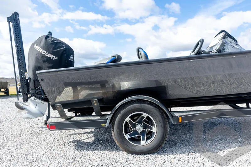 Slide: The Image of 2020 Ranger RT188P boat with Mercury engine on a trailer, parked on gravel. - 14