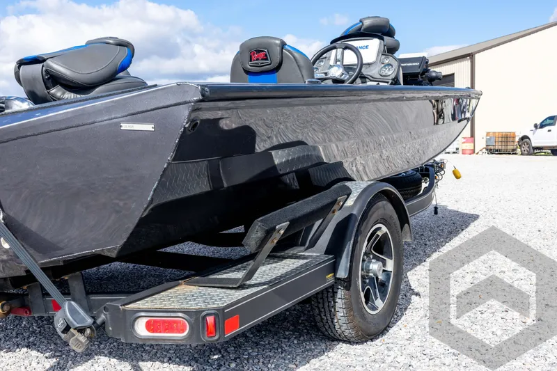 Slide: The Image of 2020 Ranger RT188P boat on trailer, black exterior, parked outdoors. - 17