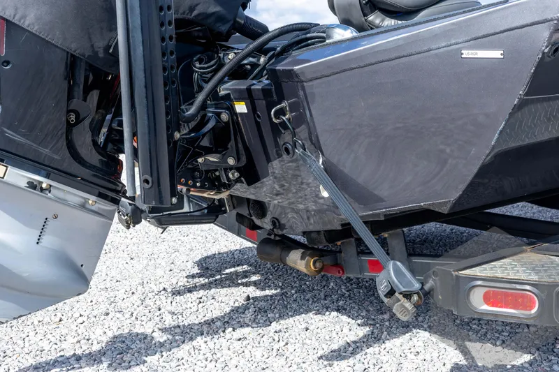 Slide: The Image of 2020 Ranger RT188P boat engine and trailer detail on gravel surface. - 18
