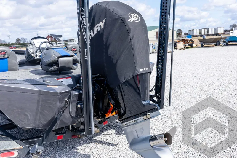 Slide: The Image of 2020 Ranger RT188P boat with covered Mercury outboard motor on gravel lot. - 21
