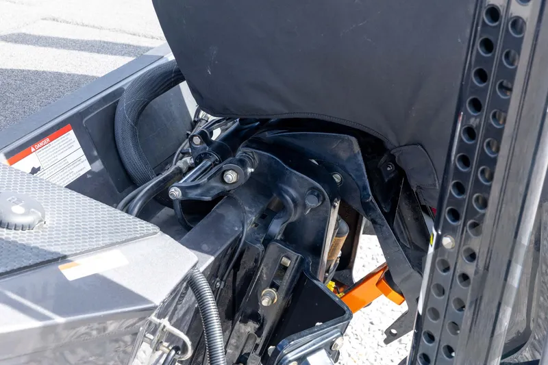 Slide: The Image of 2020 Ranger RT188P boat engine compartment with visible components and warning label. - 23