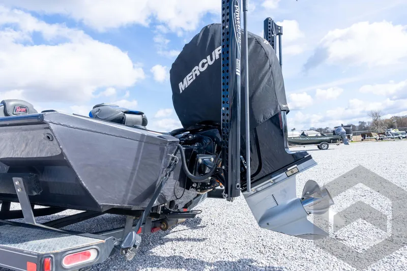 Slide: The Image of 2020 Ranger RT188P boat with Mercury engine on trailer, parked on gravel lot. - 24