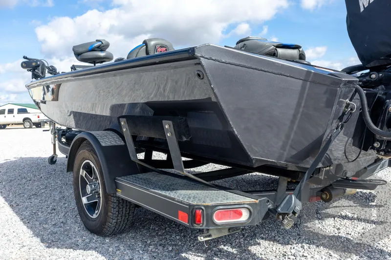 Slide: The Image of 2020 Ranger RT188P boat on trailer, parked on gravel under blue sky. - 26