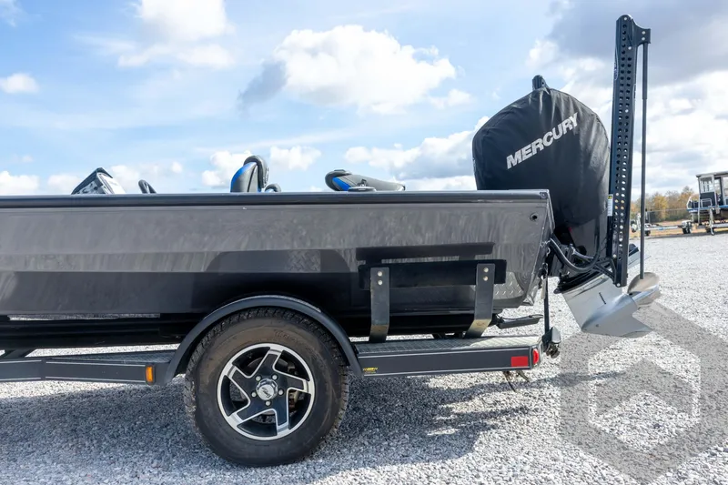 Slide: The Image of 2020 Ranger RT188P boat with Mercury engine on a trailer, parked on gravel. - 27