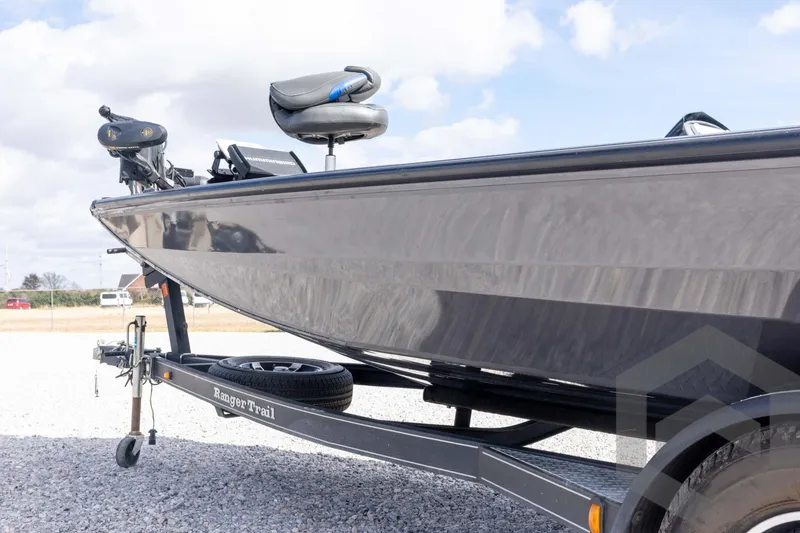 Slide: The Image of 2020 Ranger RT188P boat on trailer, parked outdoors under cloudy sky. - 28