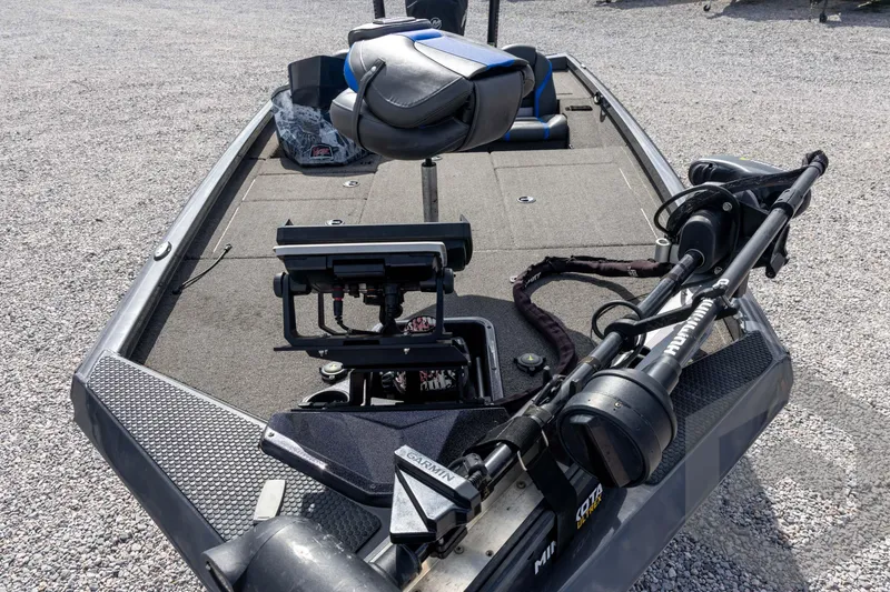 Slide: The Image of 2020 Ranger RT188P fishing boat with advanced equipment and seating on gravel surface. - 29