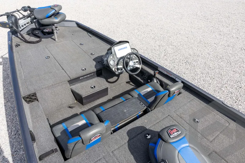 Slide: The Image of 2020 Ranger RT188P boat interior with steering console and seating, featuring gray and blue accents. - 30