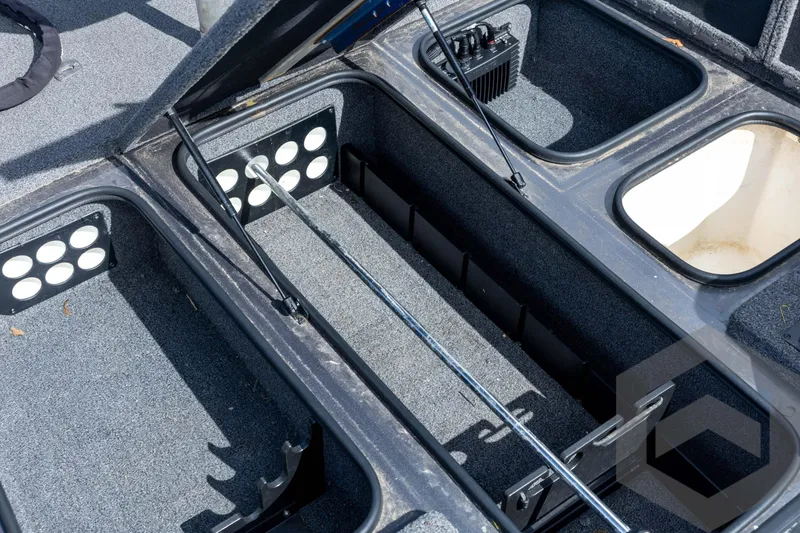 Slide: The Image of 2020 Ranger RT188P boat storage compartments with open lids, showcasing interior layout. - 37