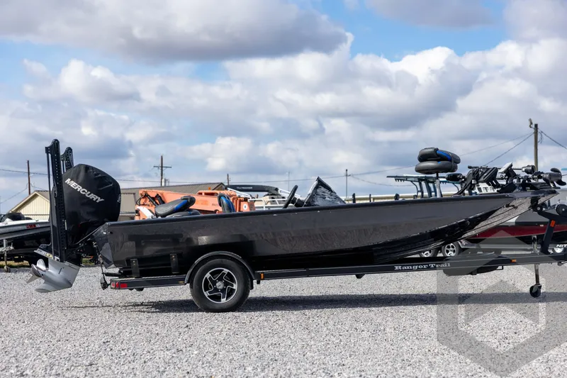 Slide: The Image of 2020 Ranger RT188P boat with Mercury engine on trailer, parked on gravel lot. - 4