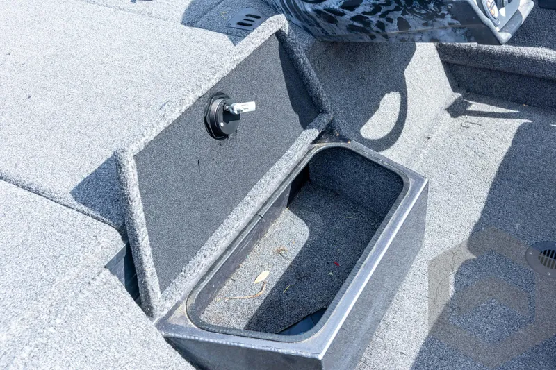 Slide: The Image of 2020 Ranger RT188P boat storage compartment with open lid, showing interior details. - 44